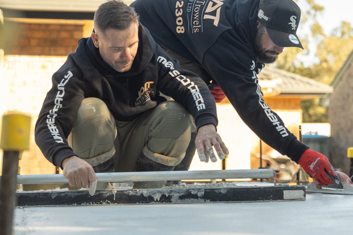 Jack of All Trowels crew screeding concrete