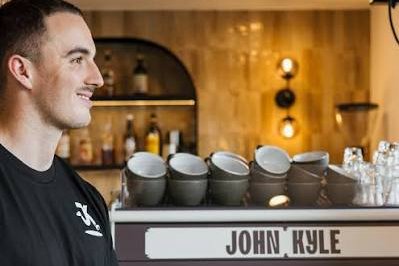 John Kyle serving coffee at the John Kyle Espresso machine
